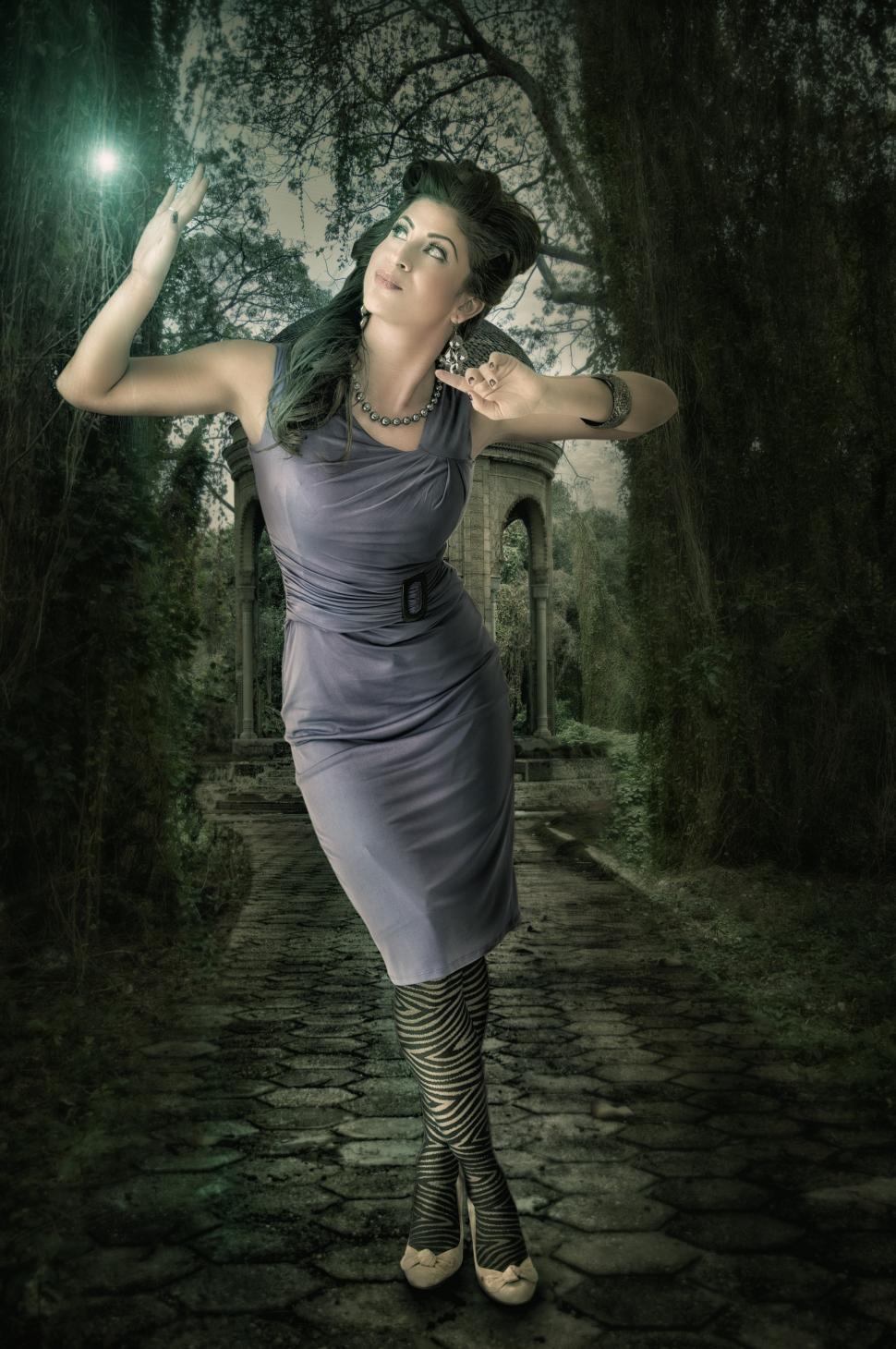 Free Image of Young woman on a wooded road 