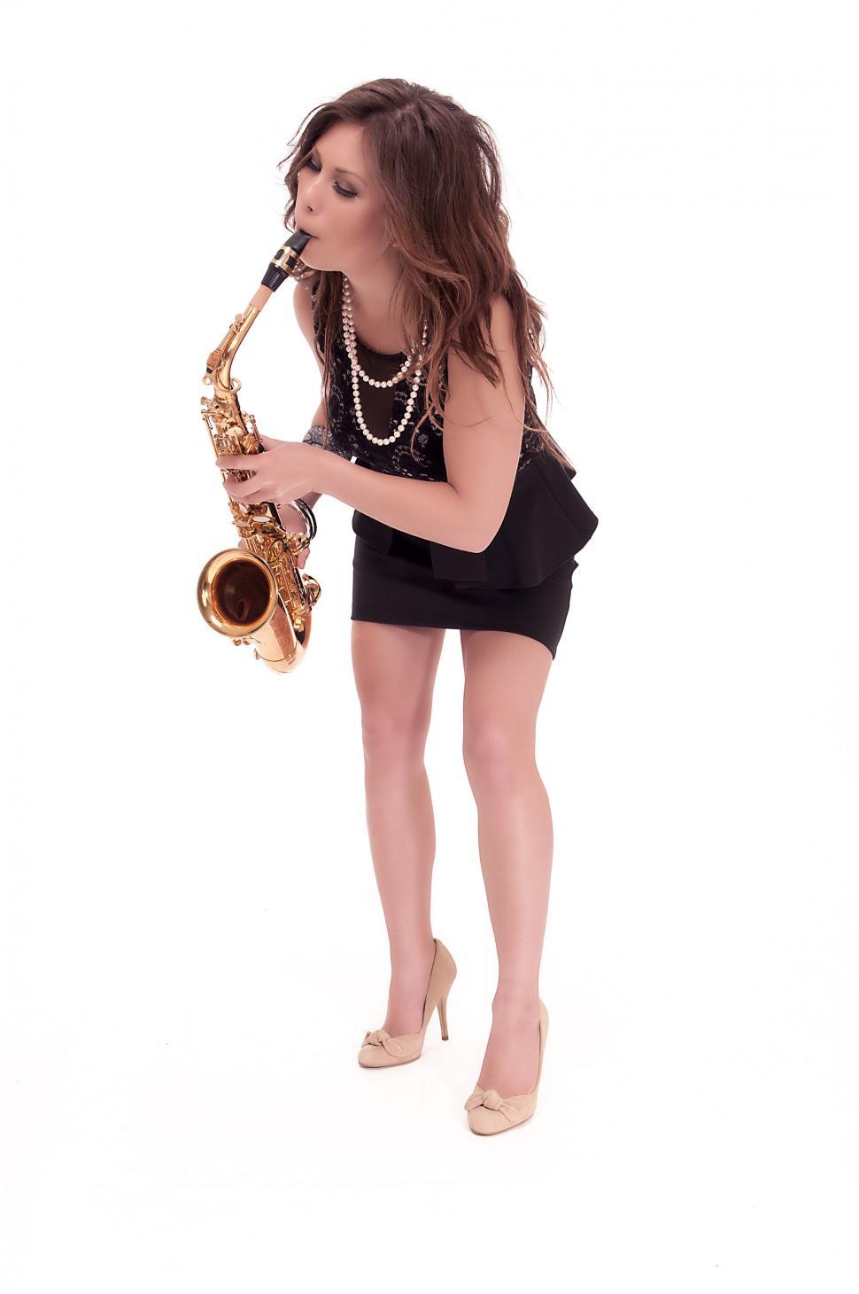 Free Image of Woman playing the saxophone 
