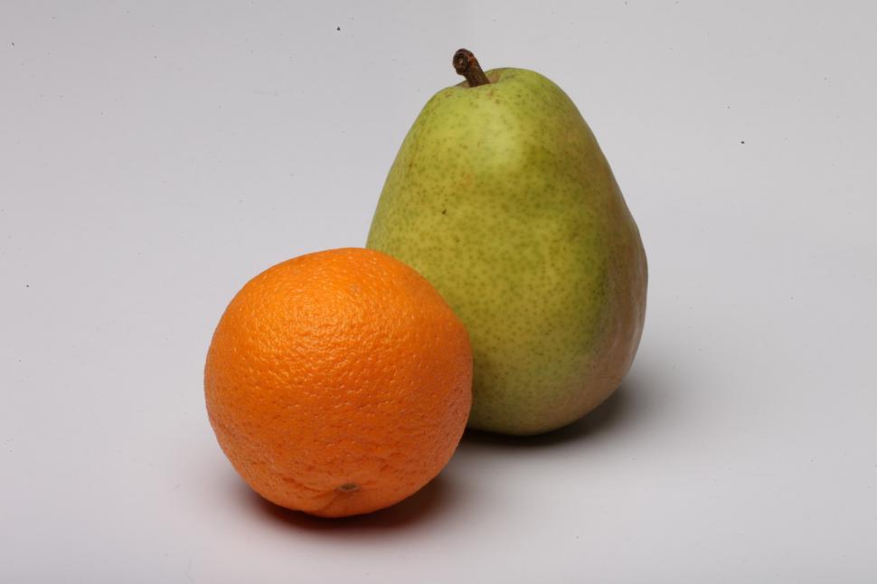 Free Image of Pear and Orange isolated on white. 