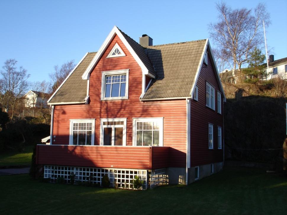 Free Image of Red House With Brown Roof and White Windows 