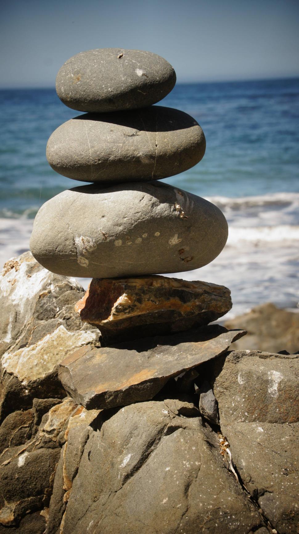 Download Free Stock Photo of Rock Stacking by the Ocean 