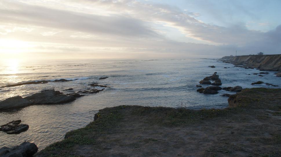 Free Image of Rocky Shoreline at Sunset 
