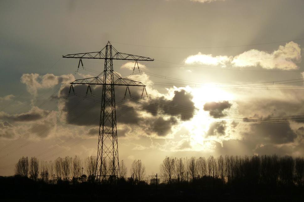Free Image of Setting sun behind power lines 