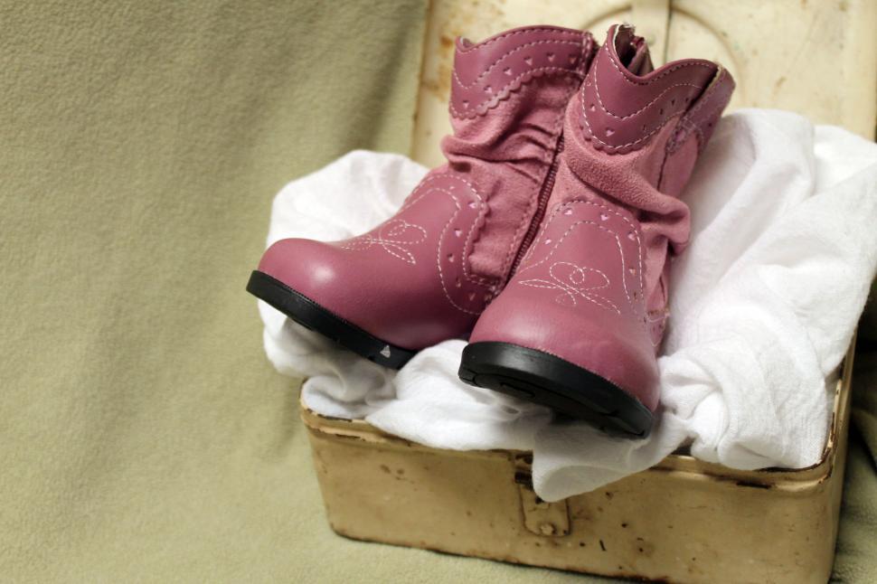 Free Image of Pink Boots on Luggage 