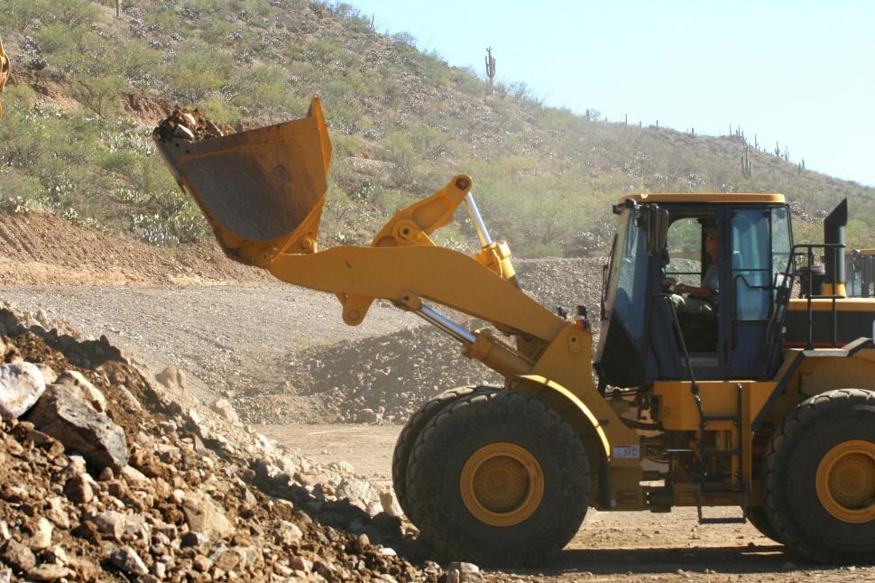 Free Image of Front loader with scoop of dirt 