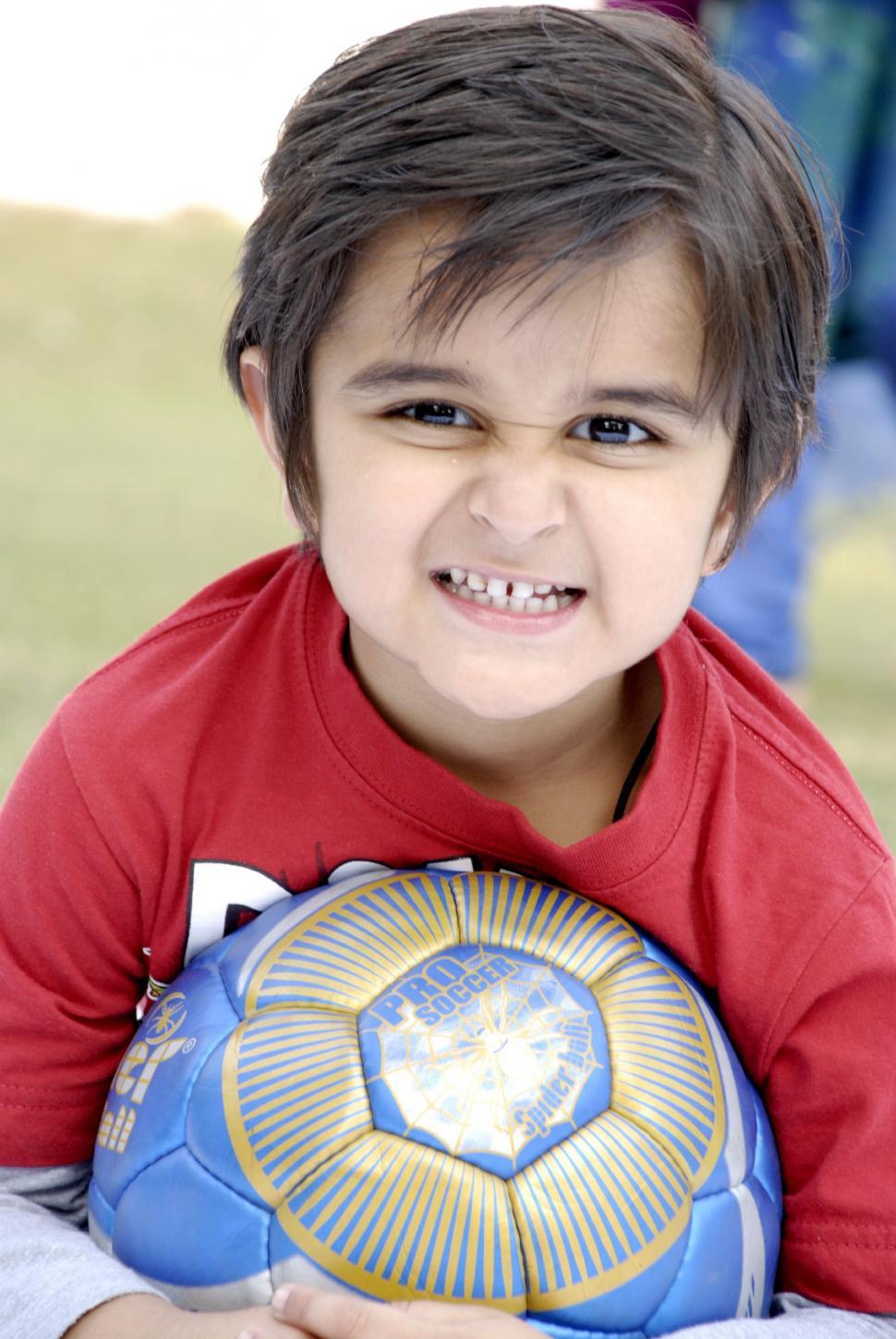 Free Image of Cute Kid with Football 