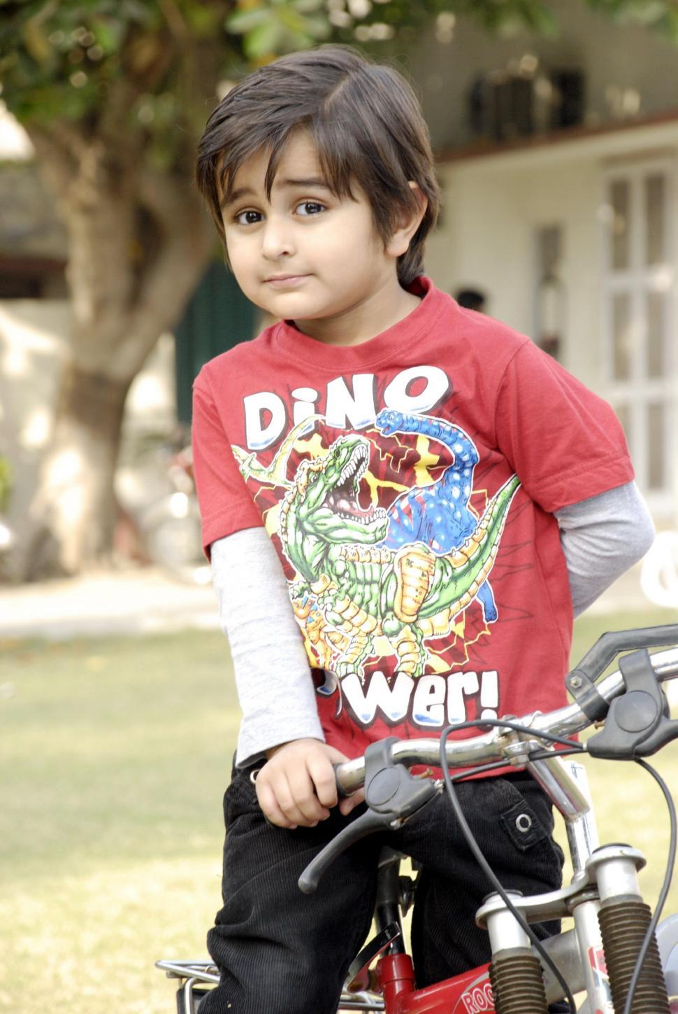 Free Image of Cute Child with Bicycle 