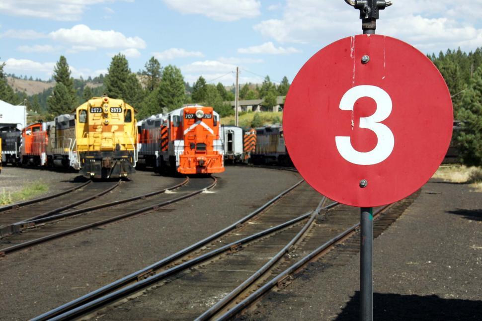 Free Image of railroad california train round sign 3 number red locomotive engine switch switchyard 