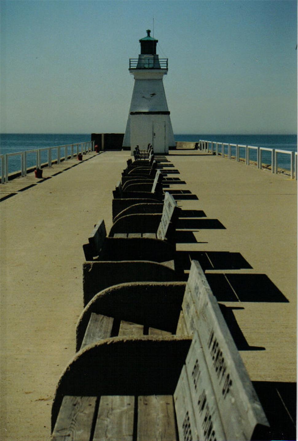 Free Image of Light House on Pier by Ocean 
