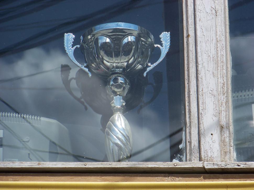 Free Image of Trophy in window 