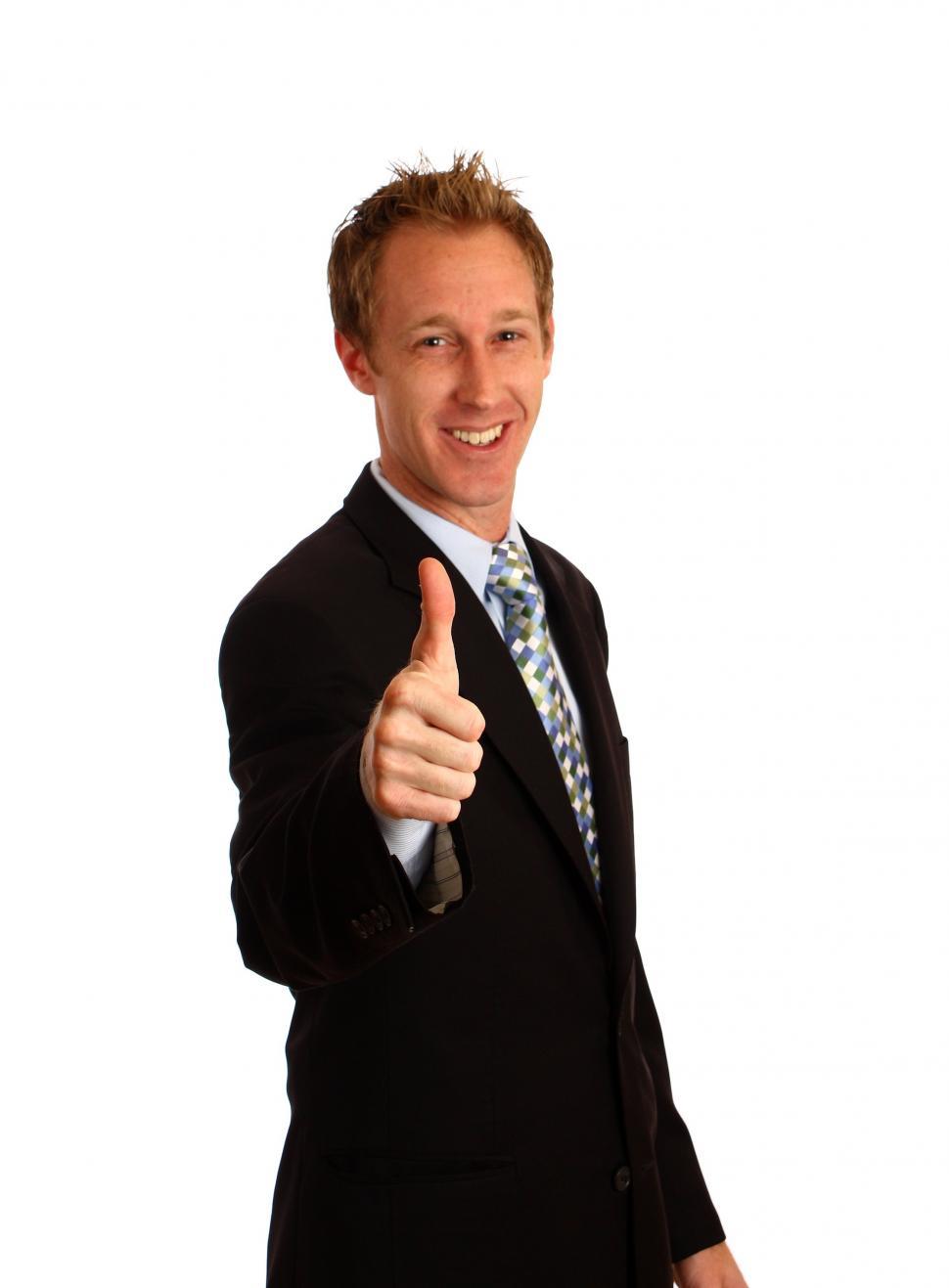 Free Image of A Young Businessman Giving A Thumbs Up Signal 