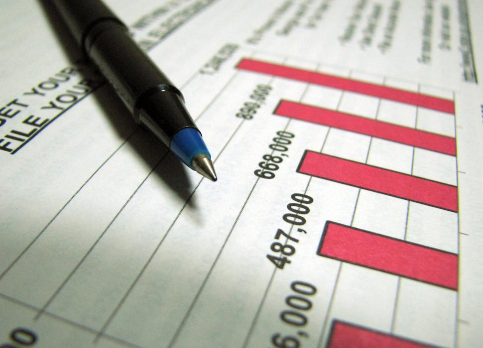 Free Image of Closeup of a tax income graph and pen 