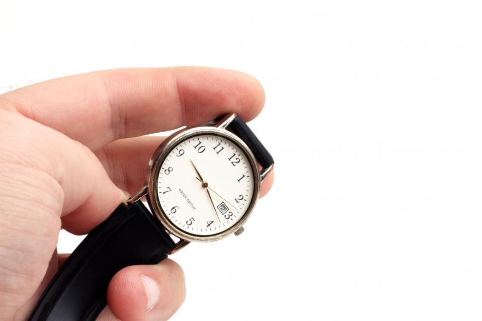 Free Image of Close-up of a hand holding a watch 