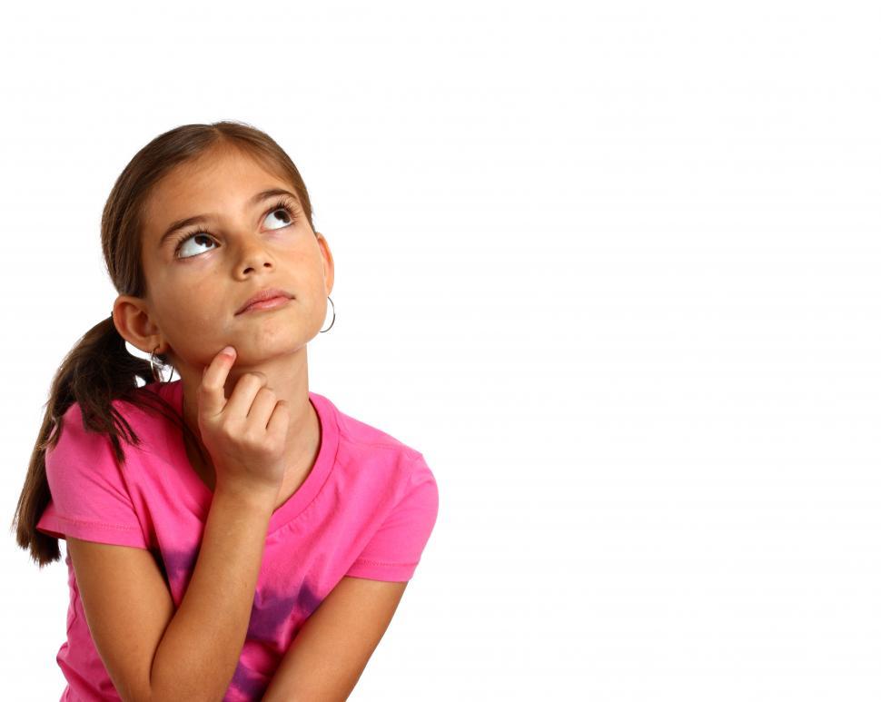 Free Image of A cute young girl with a thoughtful expression 
