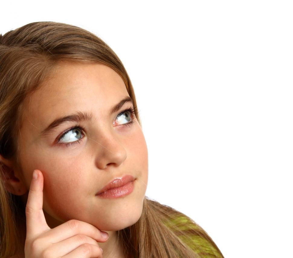 Free Image of A beautiful young girl with a thoughtful expression 