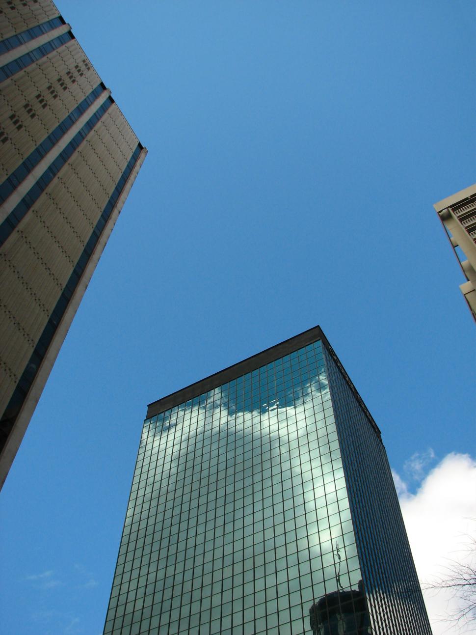 Free Image of Tall office buildings with a blue sky background 