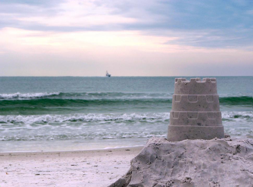 Free Image of A sandcastle overlooking the ocean 