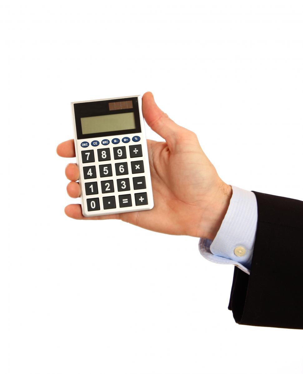 Free Image of A hand holding a calculator 