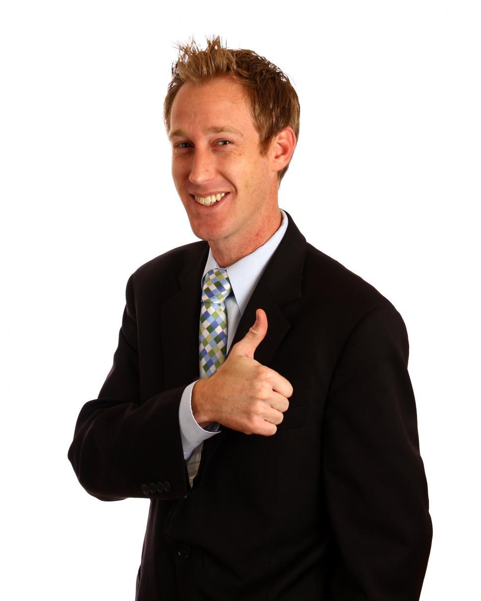 Free Image of A young businessman giving a thumbs up signal with his hands 