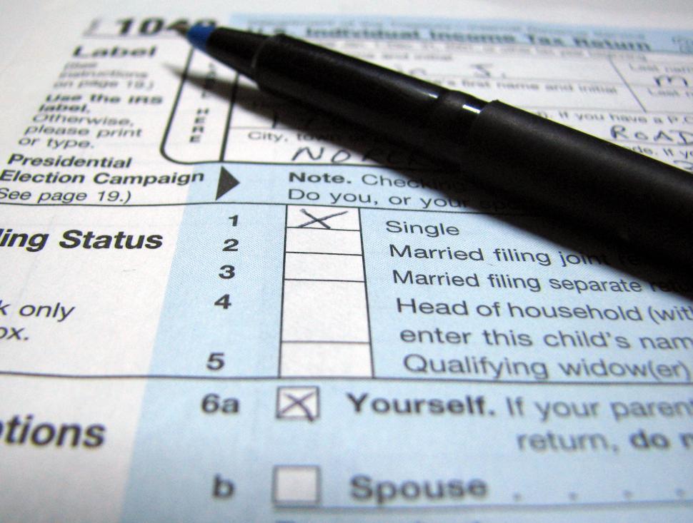 Free Image of Closeup of a 1040 tax form and a pen 