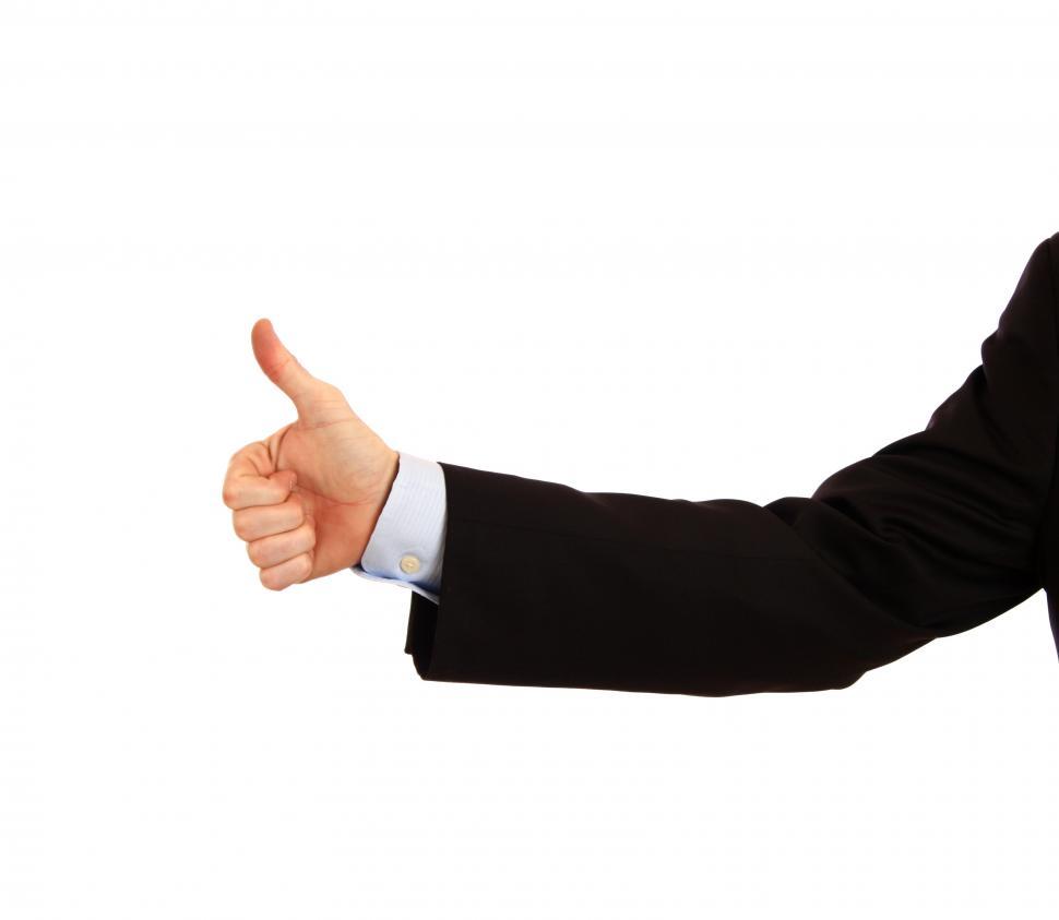 Free Image of A young businessman making a thumbs up gesture 