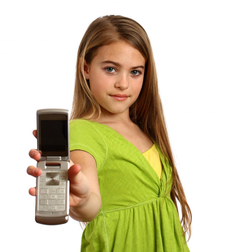 Free Image of A beautiful young girl holding a cell phone 