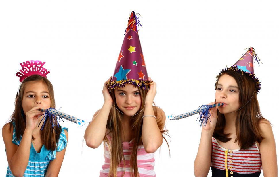 Free Image of Three young girls celebrating a birthday 