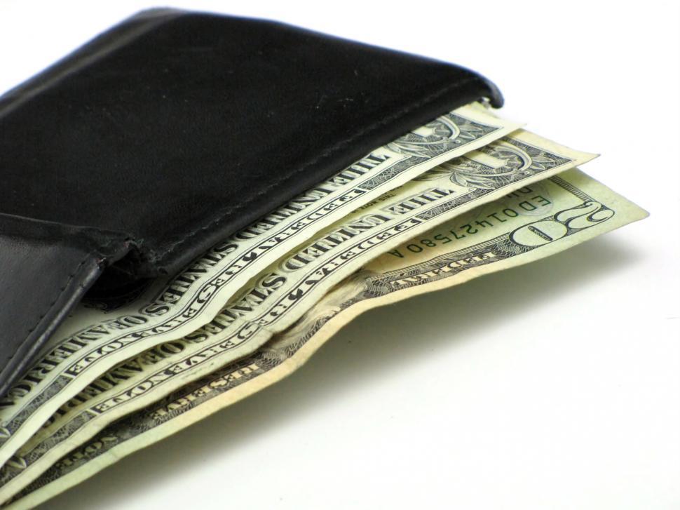 Free Image of Dollar bills in a black wallet 