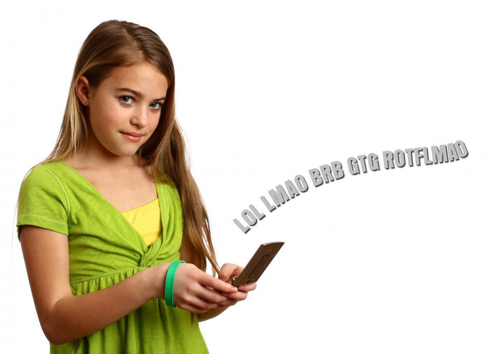 Free Image of A beautiful young girl texting on a cell phone 