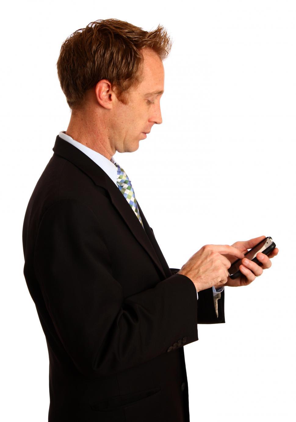 Free Image of A young businessman using a smart phone 