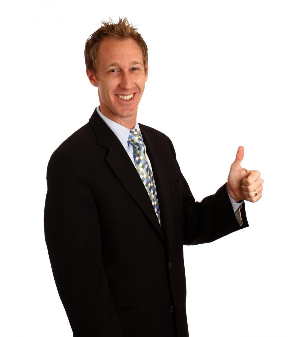 Free Image of A young businessman giving a thumbs up signal 