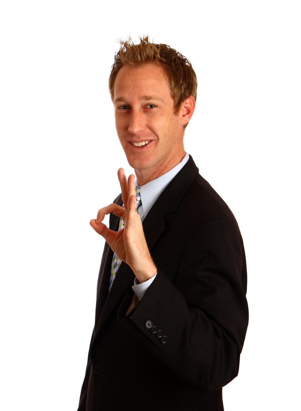 Free Image of A young businessman giving an ok signal 