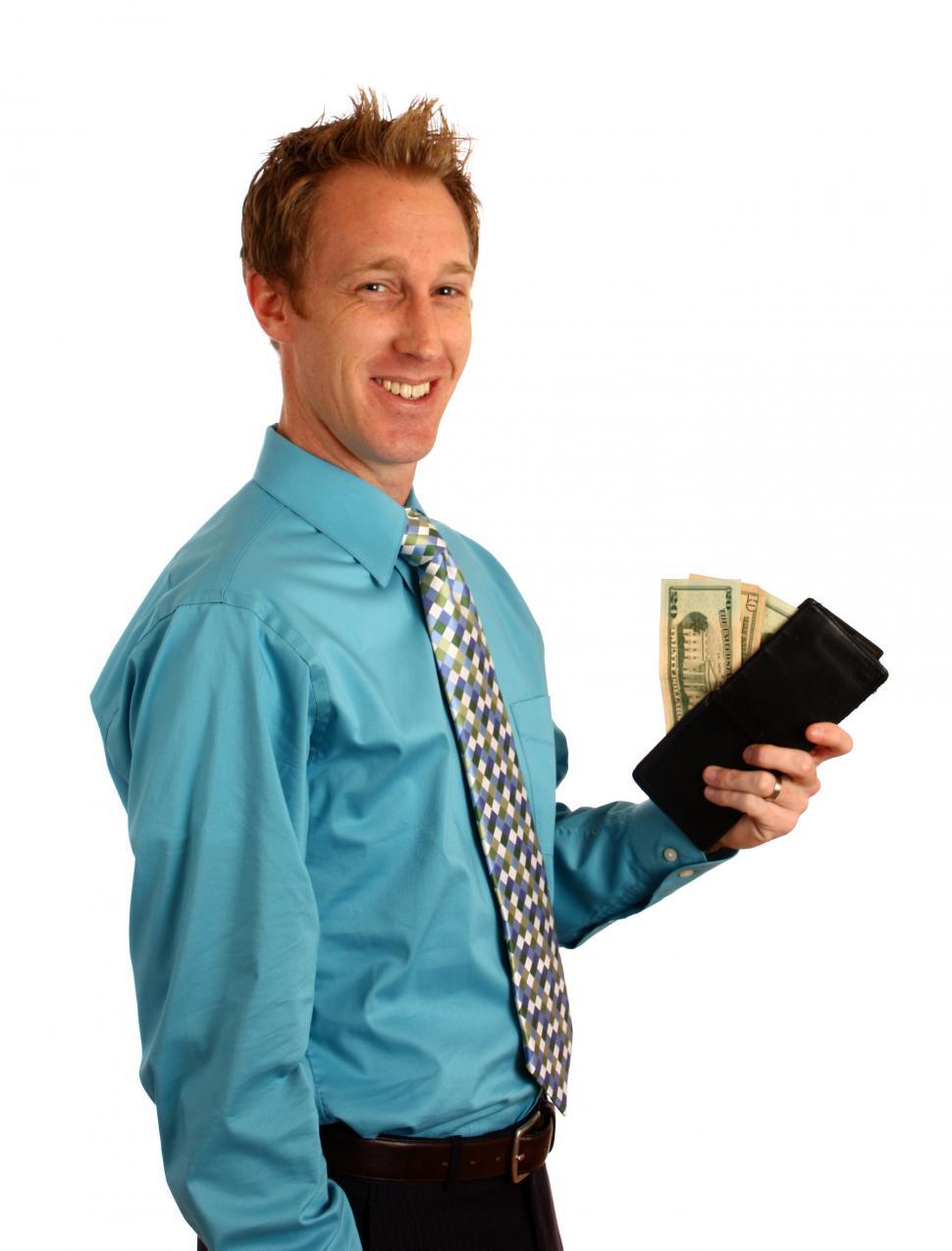 Free Image of A young businessman holding a wallet with money 