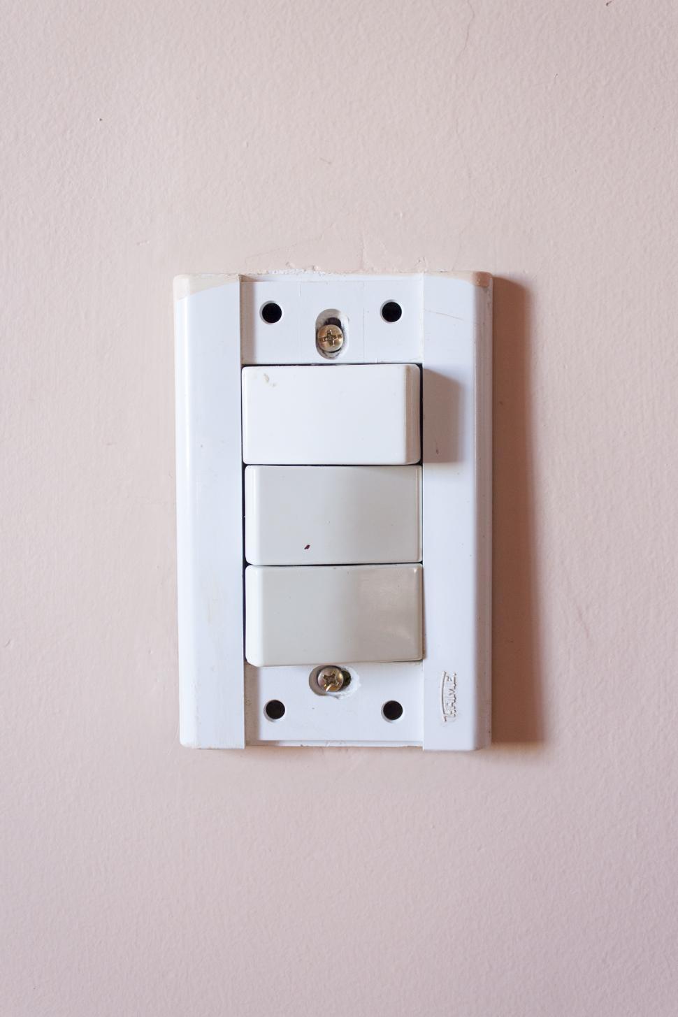 Free Image of Light Switch in Pink Background 
