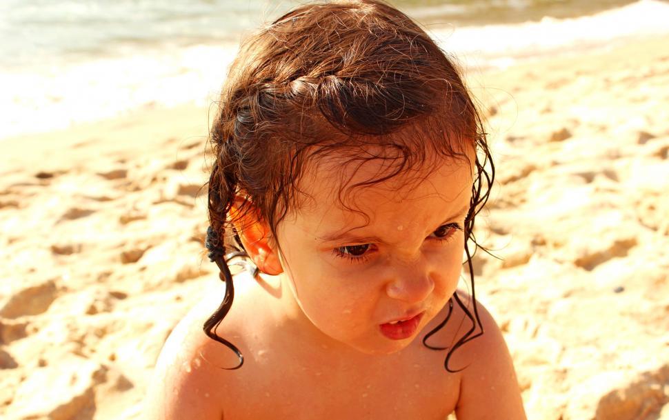 Free Image of Angry child on the beach closeup 