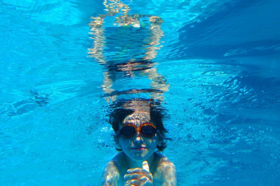 Free Image of Child swimming underwater 