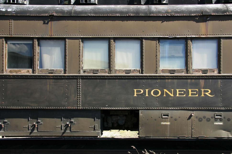 Free Image of train railroad rust decay rivet metal scrap texture window word pioneer propane passenger car brown 