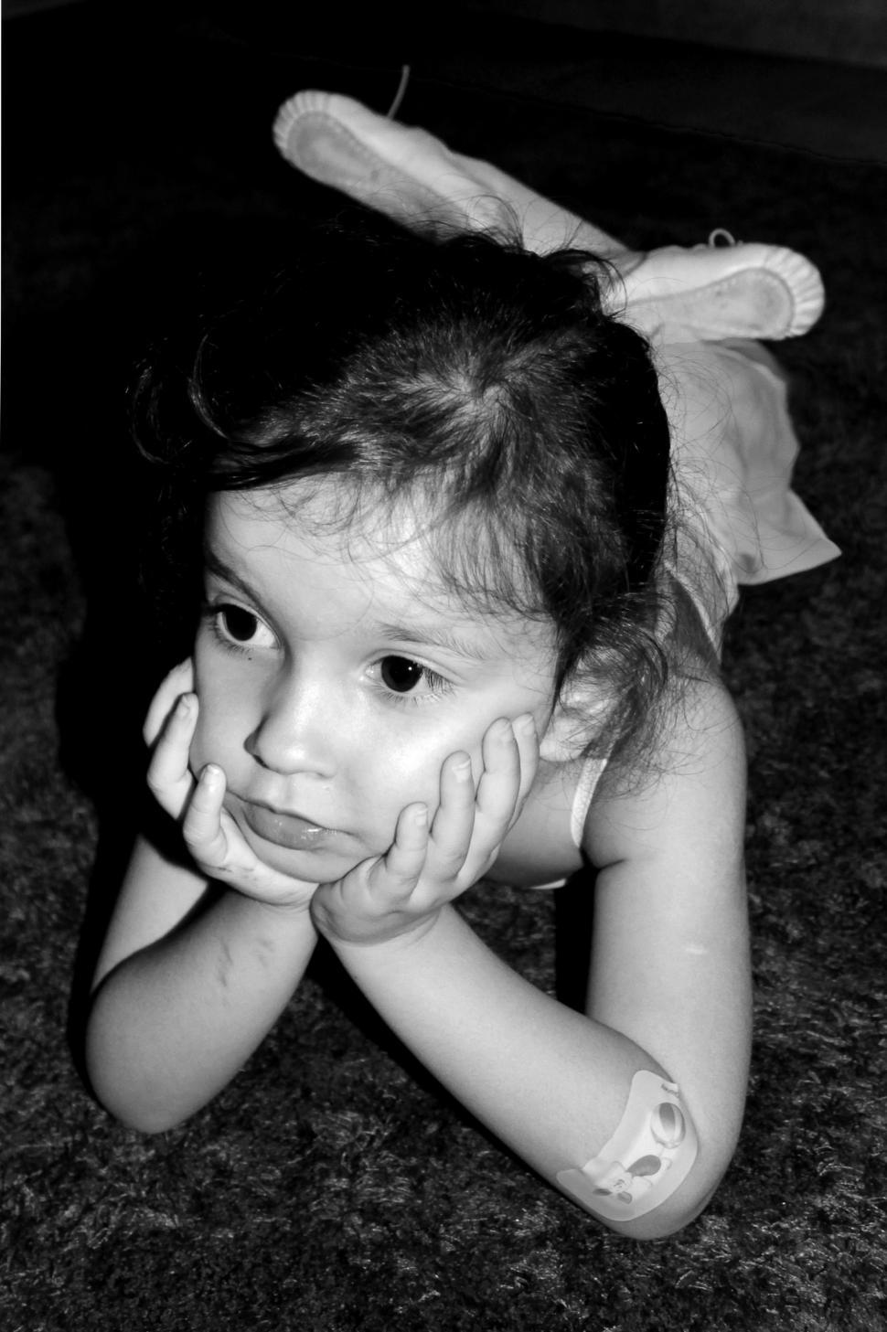 Free Image of Thoughtful young ballerina with a band aid on the elbow 