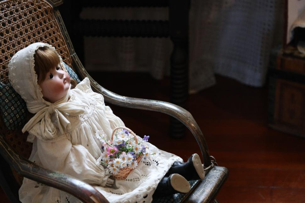 Free Image of Doll in Rocking chair 