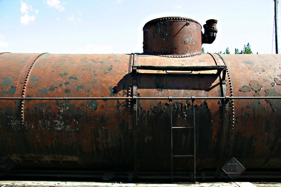 Free Image of Old Rusty Train Stationary on Tracks 