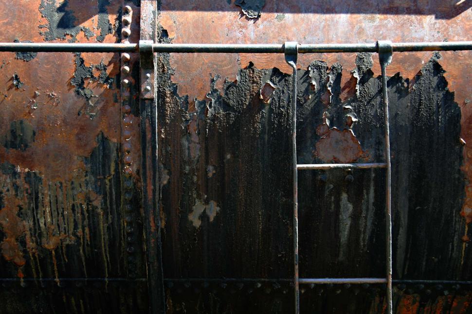 Free Image of train rust decay rivet metal scrap texture tank line railroad ladder pipe platform peel peeling paint 