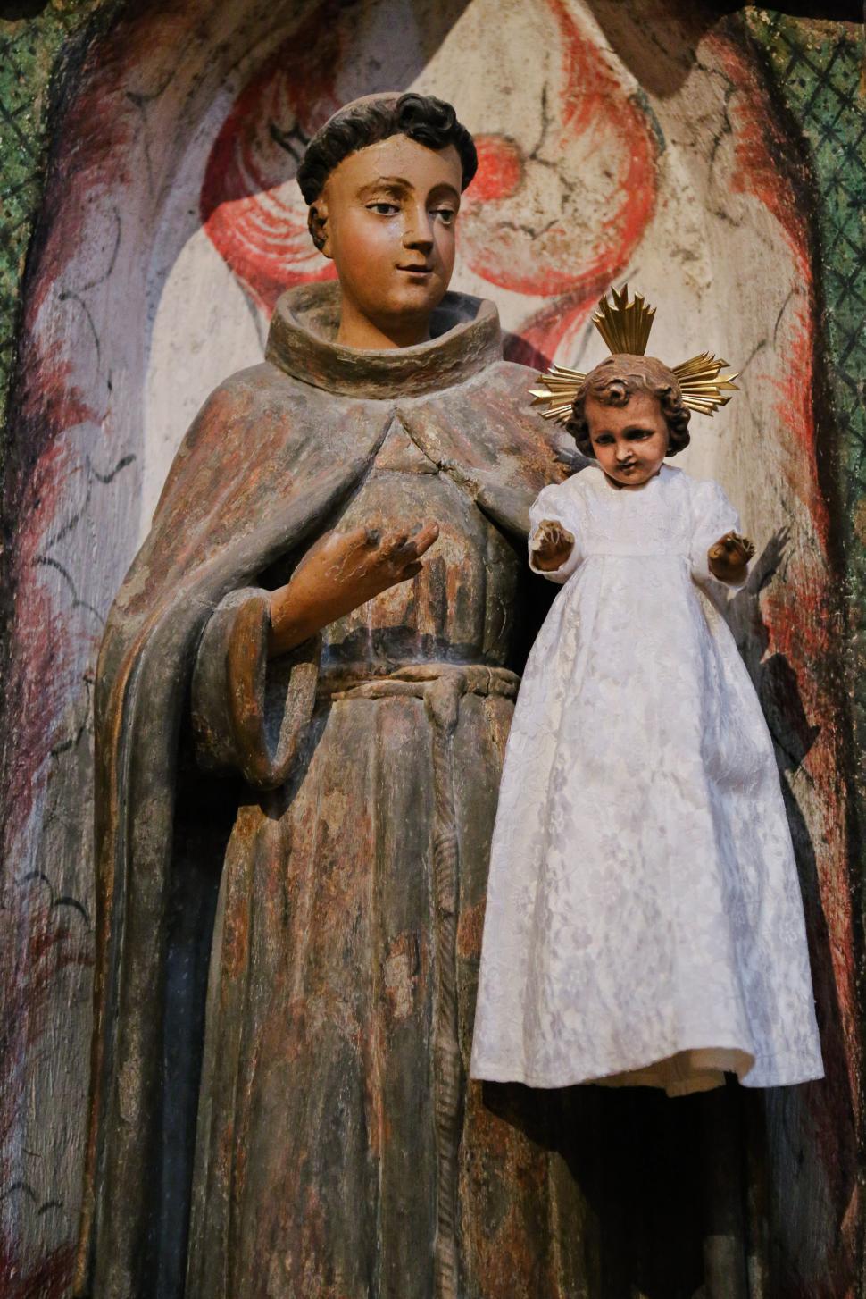 Free Image of Carved figure with child 