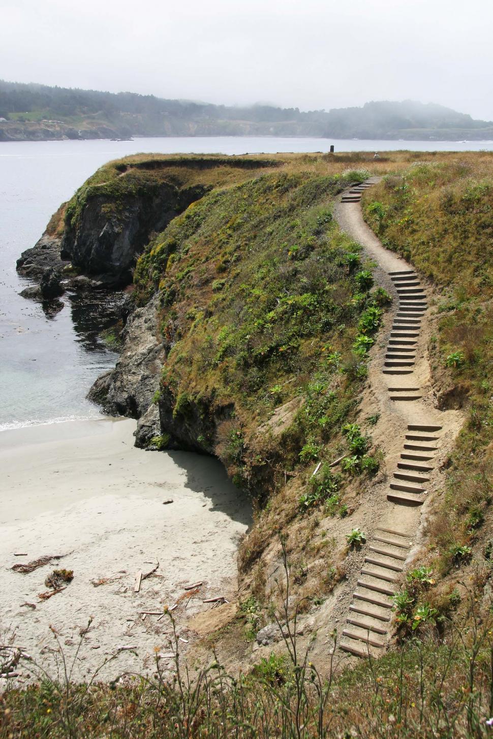 Free Image of beach mendocino california fog cliff cliffs rocky shore ocean sand wave grass steps stairs rocks 