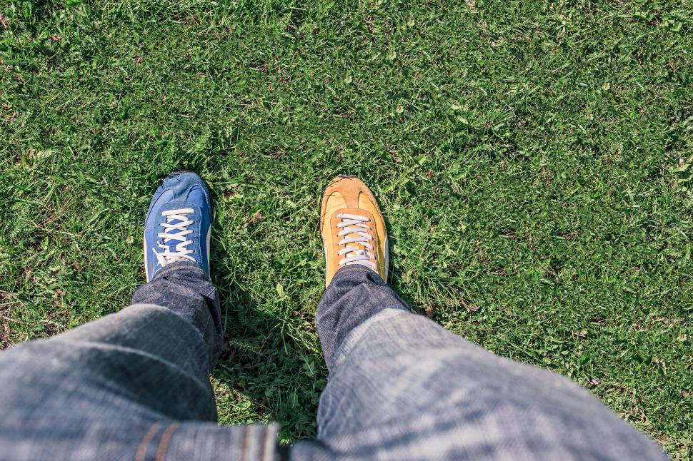 Free Image of Two different colored shoes 