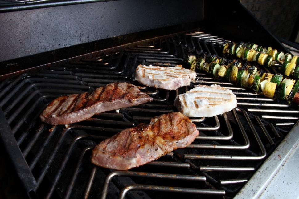 Free Image of Steak and Prokchops on the grill. 