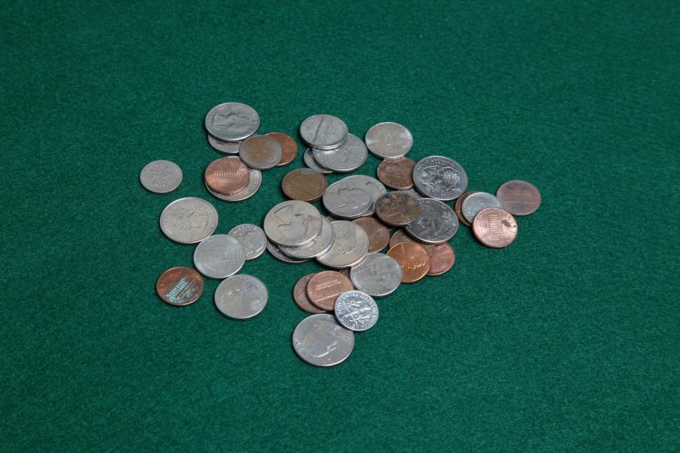 Free Image of Coins on green table 