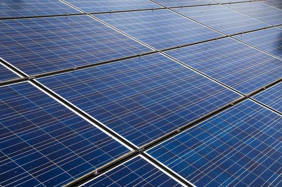 Free Image of Solar panels seen in the meadow 