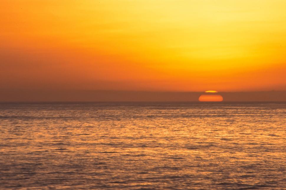 Free Image of Sun Rising Above Water 