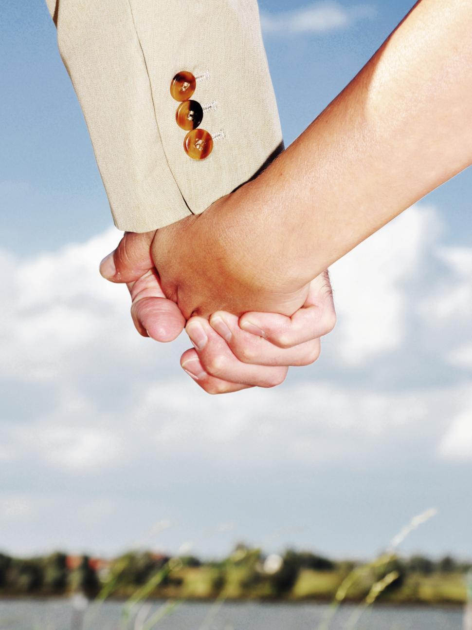 Free Image of Man and woman holding hands 