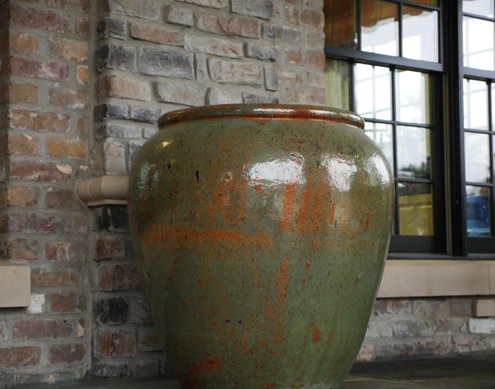 Free Image of Giant Pot and Brick Wall 